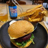 'PROHIBITED' burger €14 - Black rice burger with spinach,
barbecue sauce, red onion jelly, smoked tempeh and
caramelised pineapple,
sweet potato fries and mayo.  at 26 Vegan Food Project in Lisbon