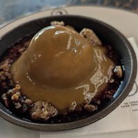 Berry crumble topped with ice cream and syrup at 26 Vegan Food Project in Lisbon