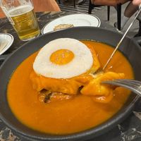 Francesinha with fried “egg"  at 26 Vegan Food Project in Lisbon