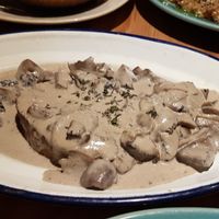 seitan steak - very filling meal. Copmes with sweet potato fries and small green salad at 26 Vegan Food Project in Lisbon