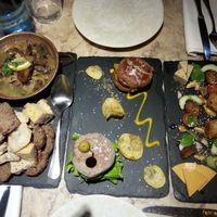 three starters: mushrooms, mini-burgers, vegan cheese and sausages  at 26 Vegan Food Project in Lisbon