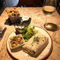 Daily menu: black bean burrito with brown rice and cilantro, guacamole and green salad + sweet potato chips. at 26 Vegan Food Project in Lisbon