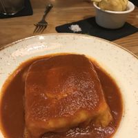 Vegan meaty and cheesy bread type lasagne dish - old fashion Portuguese dish   at 26 Vegan Food Project in Lisbon
