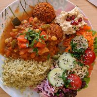 Smokey bean patties with millet, tajine, hummus and salad at Flowers Kitchen in Luxembourg City