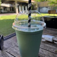 Coconut milkshake with spirulina   at The Cashew Tree in Pecatu