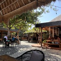 All the seatings are arranged around a courtyard. Very chill and cozy vibe.  at The Cashew Tree in Pecatu