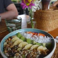 Mixed berry smoothie bowl topped with granola, fresh fruit and coconut at The Cashew Tree in Pecatu