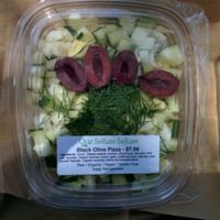 black olive pizza: cucumber,kalamata olives,fennel with crust made of walnuts,zuchinni and almond pulp at Que SeRaw SeRaw in Burlingame