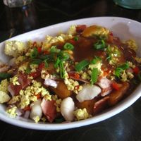 Breakfast poutine with extra vegan cheese and vegan bacon. It was pretty good, but way too salty for my taste buds. at L'Gros Luxe 100% Vege in Montreal