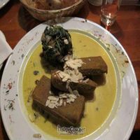chickpea polenta in curry sauce with spinach,almonds and raisins at Cafe V in Berlin