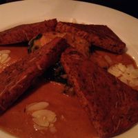 spicy chick pea polenta with curry sauce & spinach with almonds at Cafe V in Berlin