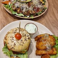 Salad bowl with sweet potato, avocado, kale, spinach, sweet corn, quinoa and a mix of seeds + Porto burger at Sweet Rawmance in Paris