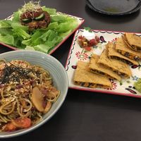 Schnitzel burger (top), yakisoba (left), and quesadilla (right) at Green Time in Auckland
