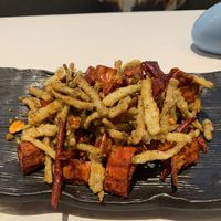 Fried mushrooms. Not very good. Tasted lil spiced up McDonald’s fries   at Ruolanci Vegetarian 若蘭慈素食馆(欢乐海岸店) in Shenzhen