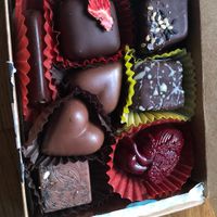 Assorted chocolates: strawberry balsamic caramel, tahini meltaway, milk chocolate heart, bleeding heart, ancho cinnamon, and yuzu cashew cream. at Lagusta's Luscious Cafe in New Paltz
