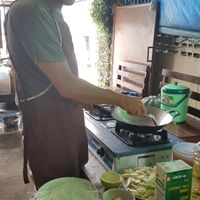 Stirring some herbs and spices at Bodhi Tree Cafe in Chiang Mai