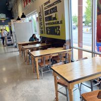 Tables for eating your wares  at Whole Foods Market in Bedford