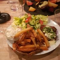 In the back: cold onions and beets (12,5 euro). In the front: steak and a tiny bit of beanaise with overcooked fries and a stiff mayo (17,5 euros) at Mediamatic ETEN in Amsterdam