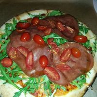 Vegan parma ham, tomato and rocket pizza at Pizzare in Berlin