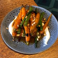 Honey roasted carrots & asparagus with whipped goats cream & pine nuts at Dux Dine in Christchurch