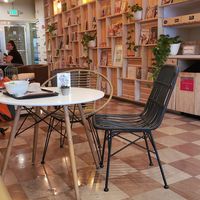 Indoor seating, community table at Manna Life Food in Miami