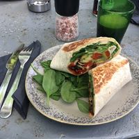 Wrap with hummus, baby spinach, grilled vegetables and avocado (has to be asked without cheese to be vegan) at Manna Manna in Brasov