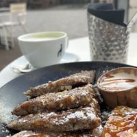 Vegan caramelized banana pancakes with coconut yogurt, really sweet and rich, enjoyed it!  at Club Vers in The Hague