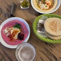 Beetroot hummus, chickpea hummus, included pita at Hummus & Friends in Berlin