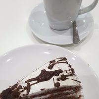 Chocolate cake and hot chocolate with cream and marshmallows. Luxurious! at Loving Hut - Southgate in Crawley