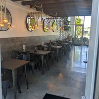 View from the entrance towards the parking lot at Holi Vegan Kitchen in North Miami Beach