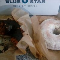 Tasty chocolate donut with chocolate icing... Lemon cake donut topped with powdered sugar topping. Bought at Portland airport location, moist & tasty even after 2 hour flight. at Blue Star Donuts - 23rd in Portland