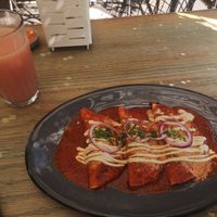 Enchiladas and agua de sabor of the day at Veguisima in Mexico City