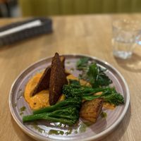 Smoked tempeh, potato gratin, on roasted pepper puree  at Veganic in Krakow