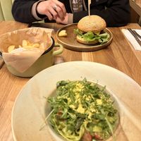 Seitan Beef Burger with Crispers Fries (furthest) and Tagliatelle with Garlic pesto and Asparagus (closest)  at Veganic in Krakow