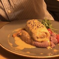 Stuffed cabbage leaves with red rice and truffle rice at Veganic in Krakow