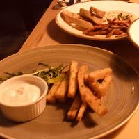 POLENTA CHIPS / HUMMUS IN THE BACKGROUND at Veganic in Krakow