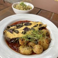 Parmigiana with pesto rice 😍  at Casa Raw in Sao Paulo