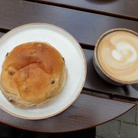 Bun with raisins and an oat latte at Godt Brød in Oslo