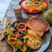 Cheese and ham toastie with couscous and salad (the meal also came with hummus crisps in a separate bowl), and pasty with salad, crisps and couscous at Planetwise & Yoga Studio in Bridlington