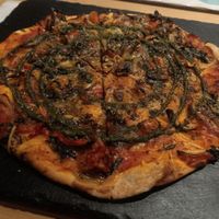 Pizza with green sauce, so nice at Cookaluzka in Madrid