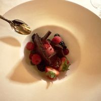 Dessert: I believe they called this “chocolate bubbles”. Raspberry sorbet, fresh berries, house-made aerated chocolate. Absolutely delicious .  at The Pointe Restaurant in Tofino