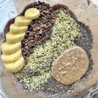Açaí bowl w/ banana, cacao nibs, hemp+chia seeds, & almond butterr  at Nourish Wellness Cafe in Northampton