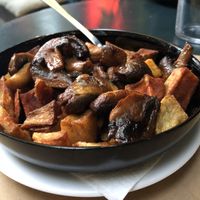 Potato wedges with mushroom and ketchup  at Mayka in Belgrade