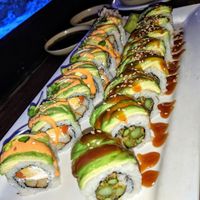 The one with brown sauce is a regular dragon Roll the other was a special on the board at UCHU Sushi in Portland