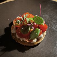 Tomato tart with black olive purée   at Yellow in Sydney