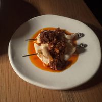 Mushroom skewer, sunflower seed, and chili crunch  at Yellow in Sydney