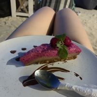 Dragonfruit and cashew cheesecake! The cheesecakes was really yum. The choc sauce was really bitter but would still order again for the main thing, the cheesecake! at Mowie's  in 