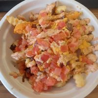 Special Style Fries with added tomato 🍅 😋 at Next Level Burger - Lake Oswego in Lake Oswego