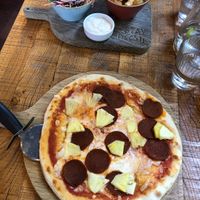 Pepperoni pizza with pineapple, tater tots and coleslaw.  at The Stable in Bath