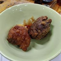 Two dumplings, left sourdough and garlic, right: spinach at Zionly Manna in South East London